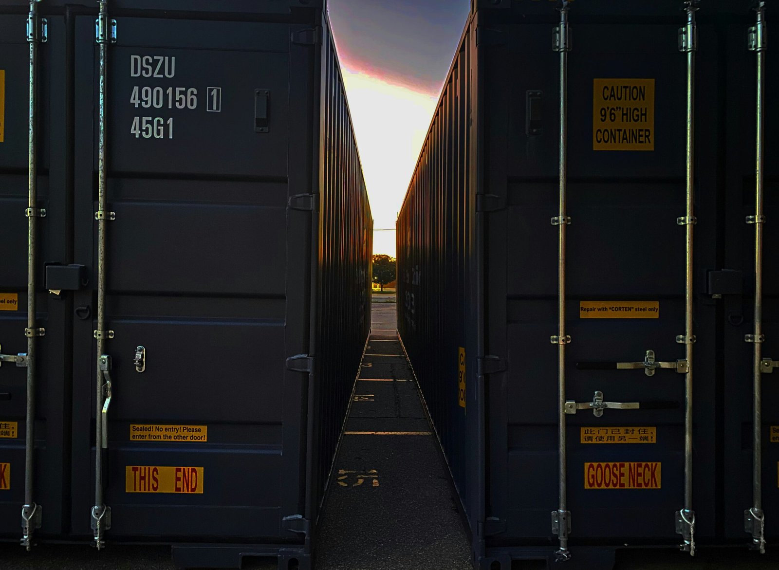 Close up of a secure padlock on a truck cargo door or high-tech logistical tracking screen.