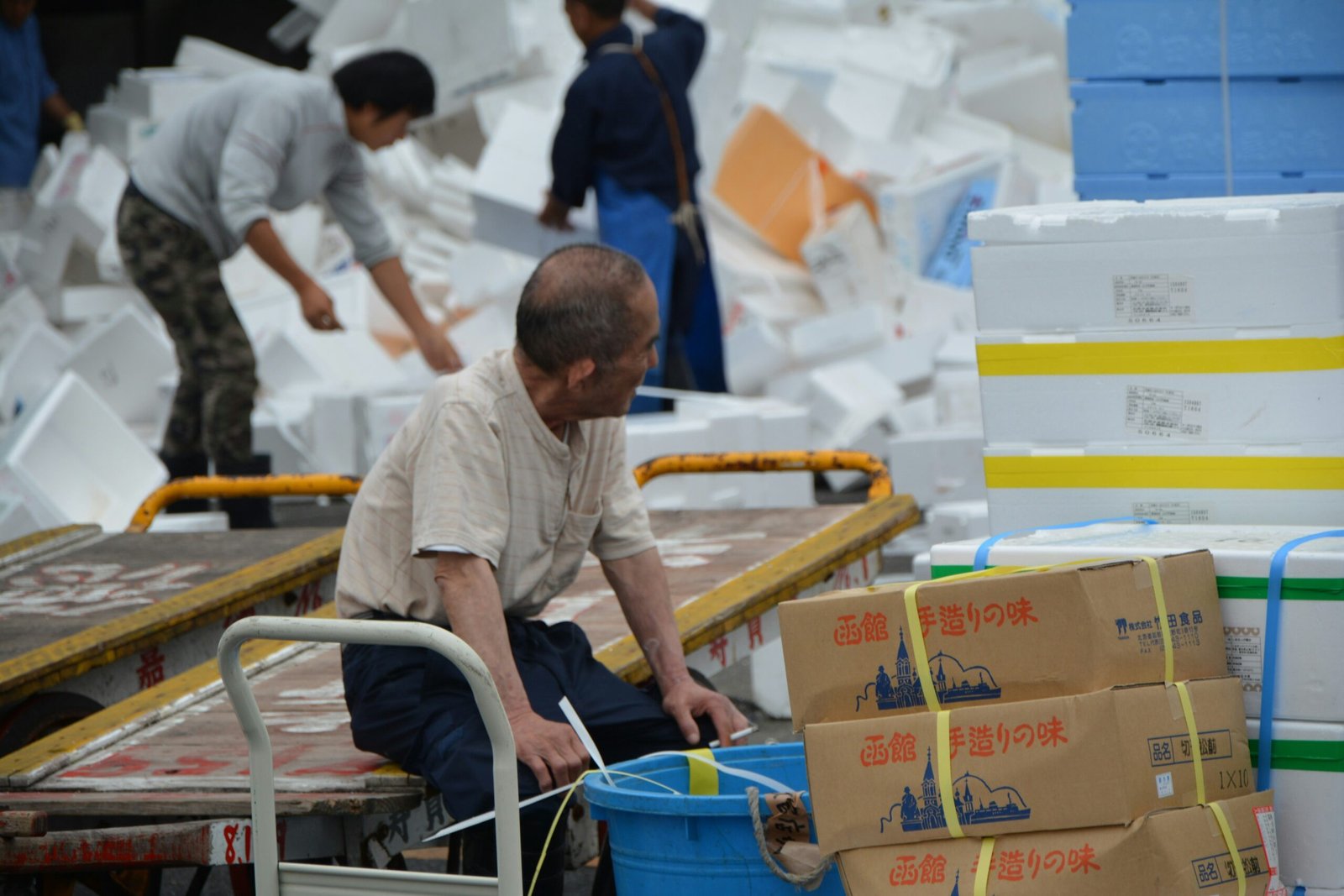 Warehouse workers sorting packages with speed and efficiency, representing flexibility.