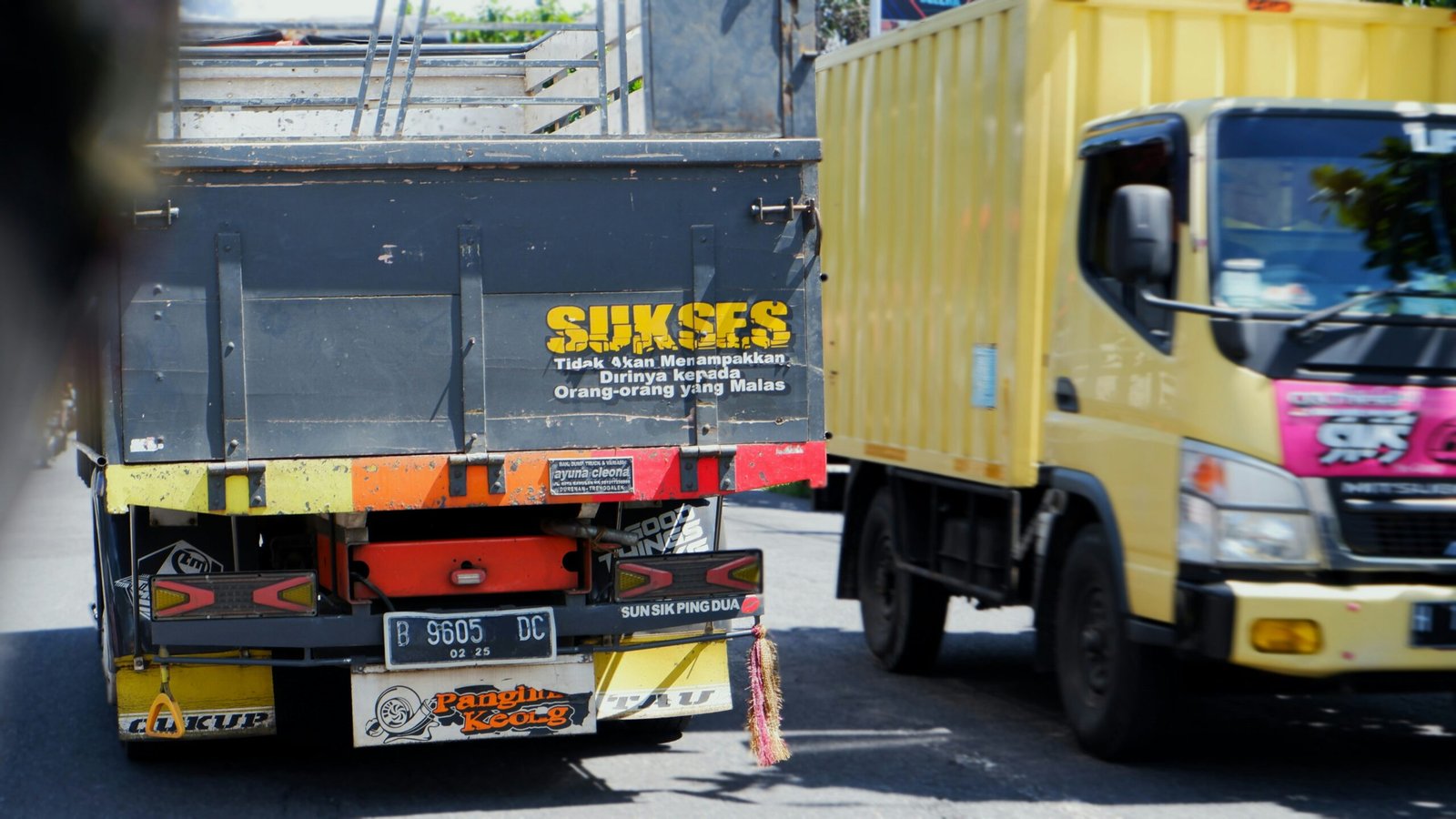 Close up of heavy duty moving straps securing a sofa inside a transport truck