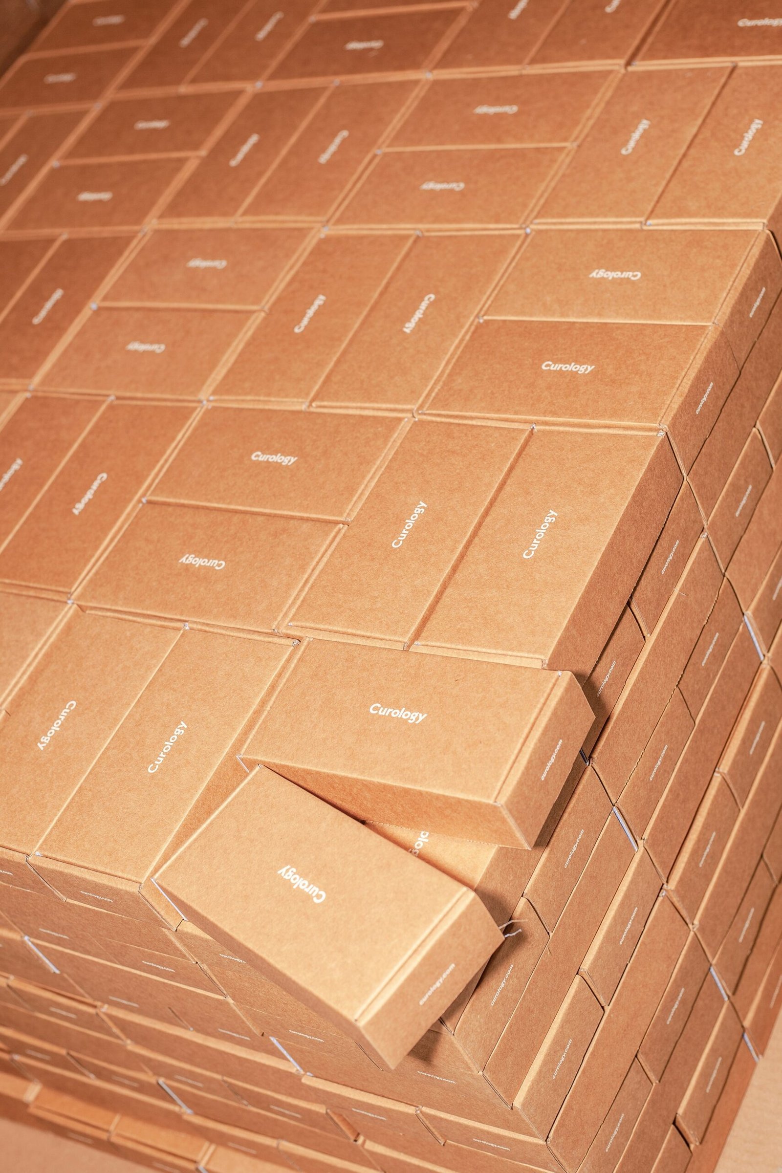 Close up of diverse dangerous goods labels on cardboard boxes inside a warehouse