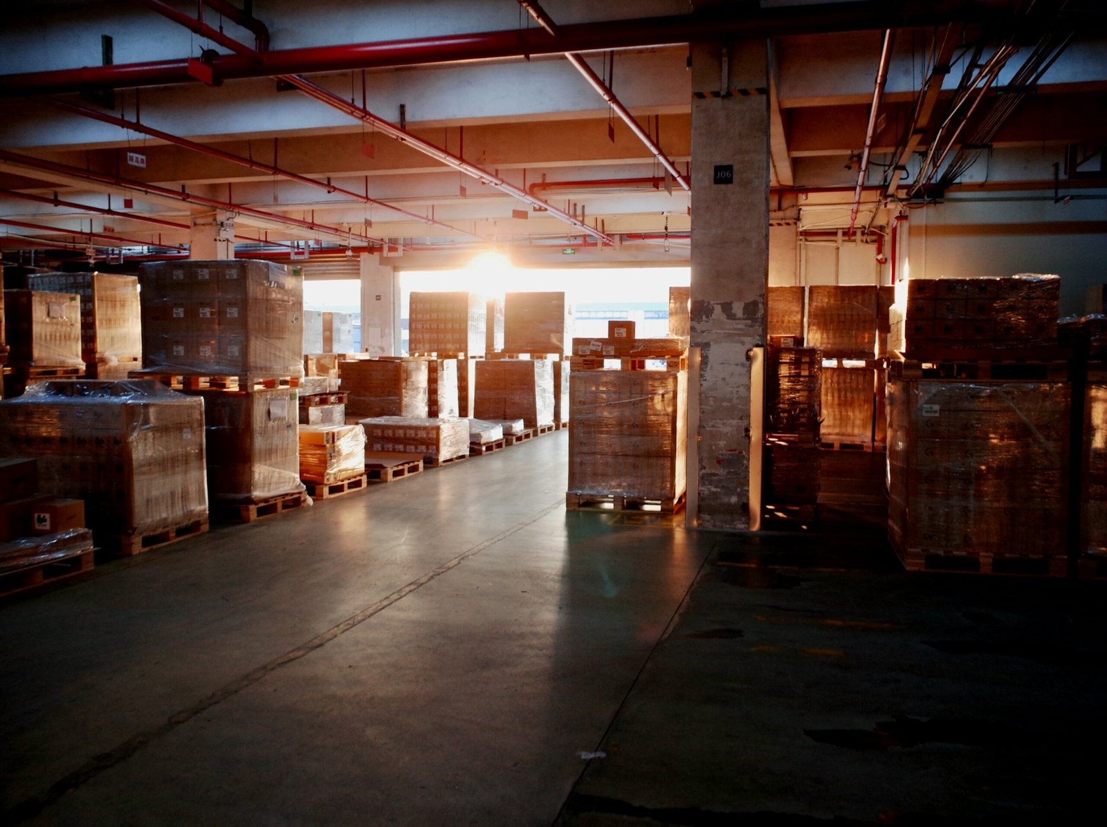 Interior warehouse shot showing organized parcels and furniture ready for groupage transport