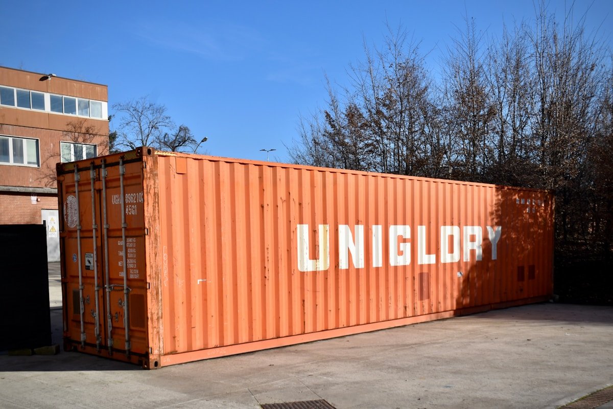 Orange shipping container with uniglory logo