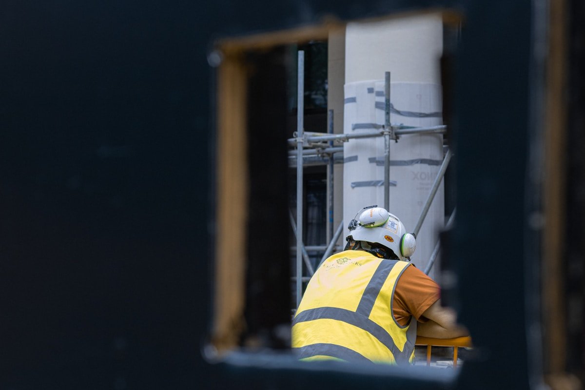 person in white helmet and yellow shirt
