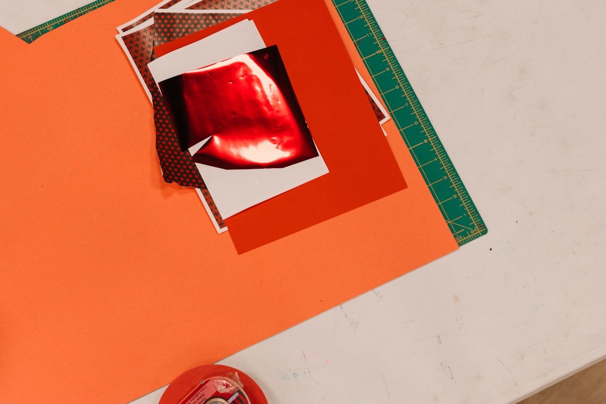 Close-up of red lips on collage materials