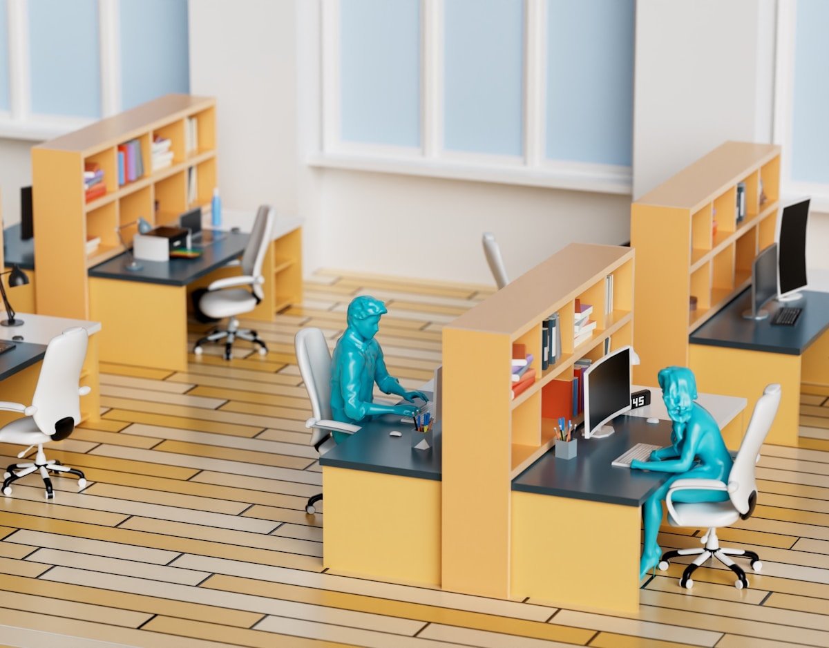 Espace de travail moderne avec meubles jaunes et figurines bleues.